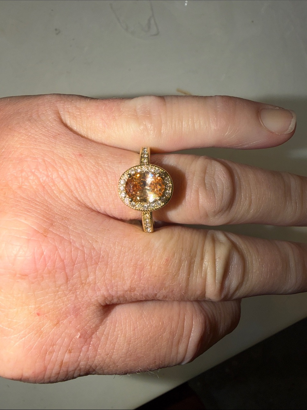 Gold Ring with Champagne Center Stone and Pave Halo